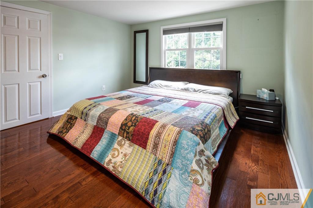 69 Ashley Road Edison, NJ 08817 - Photo 19 of 35 a bed sitting in a bedroom next to a window
