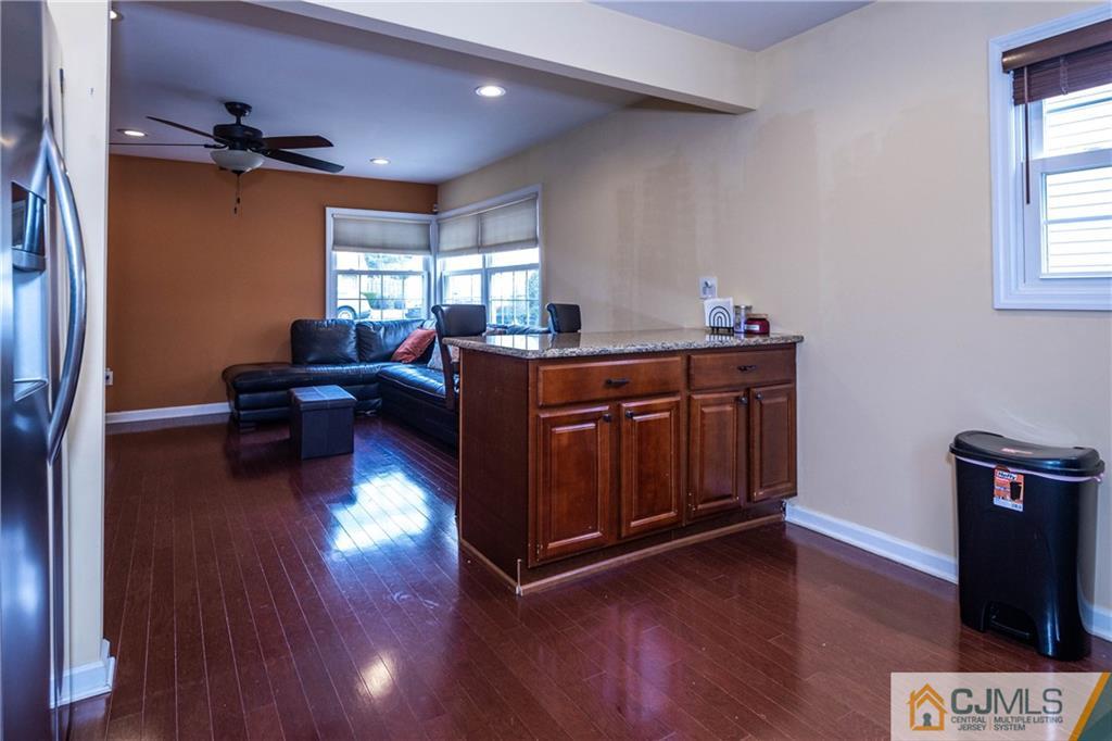 69 Ashley Road Edison, NJ 08817 - Photo 8 of 35 a living room with furniture and a wooden floor