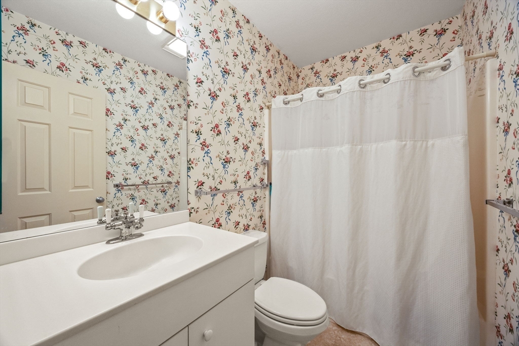 226 Kates Path, Unit 226 Yarmouth, MA 02675 - Photo 18 of 29 a bathroom with a sink toilet and shower
