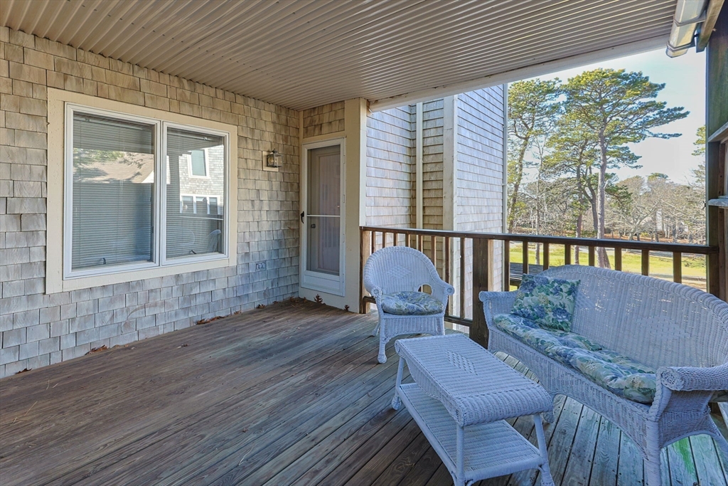 226 Kates Path, Unit 226 Yarmouth, MA 02675 - Photo 19 of 29 a outdoor living space with furniture and a window