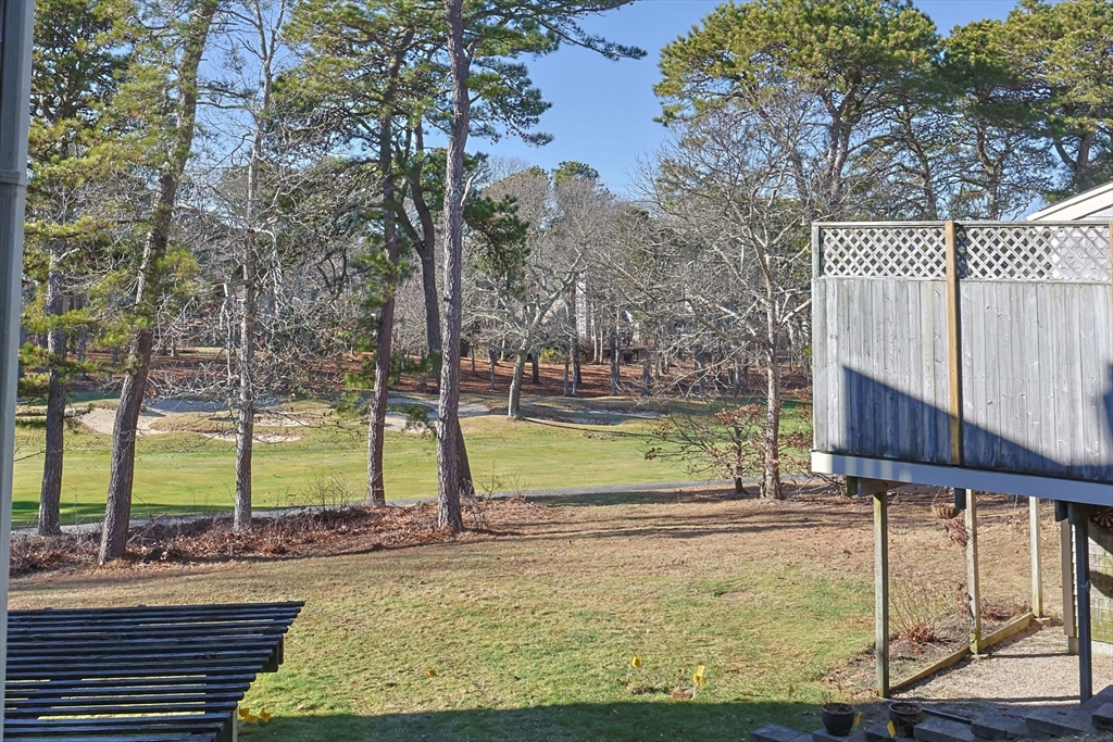 226 Kates Path, Unit 226 Yarmouth, MA 02675 - Photo 22 of 29 a view of a yard with swimming pool