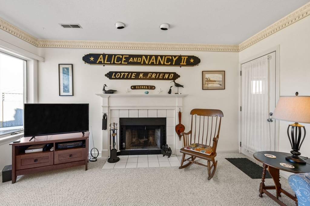 226 Kates Path, Unit 226 Yarmouth, MA 02675 - Photo 5 of 29 a living room with furniture and a flat screen tv