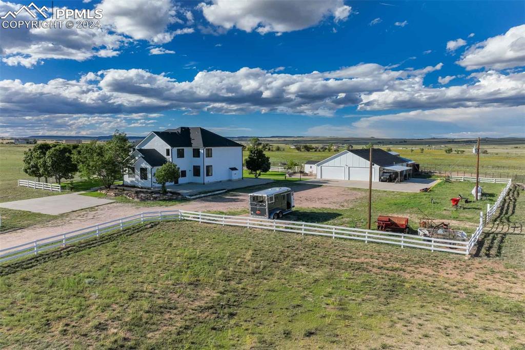 20880 Scott Road Calhan, CO 80808 - Photo 1 of 50 View of yard with a garage and a rural view