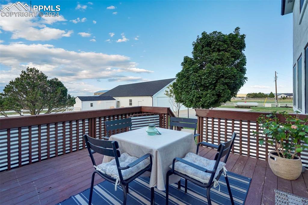 20880 Scott Road Calhan, CO 80808 - Photo 13 of 50 a view of a chairs and table on the deck