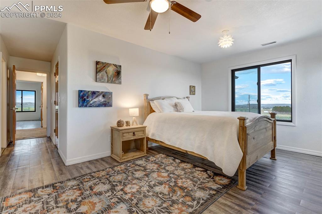 20880 Scott Road Calhan, CO 80808 - Photo 24 of 50 a bedroom with a bed and a large window