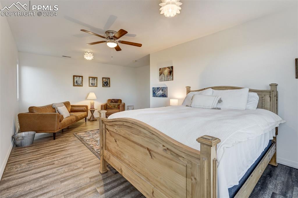 20880 Scott Road Calhan, CO 80808 - Photo 25 of 50 a bedroom with bed and a chandelier