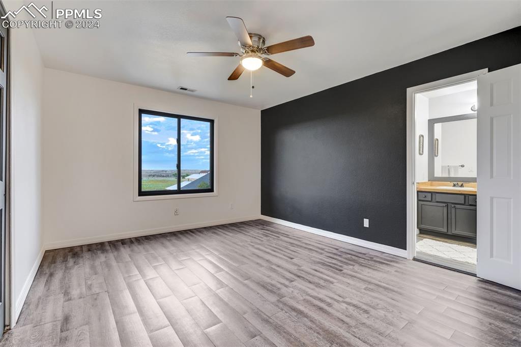 20880 Scott Road Calhan, CO 80808 - Photo 27 of 50 wooden floor in an empty room with a window