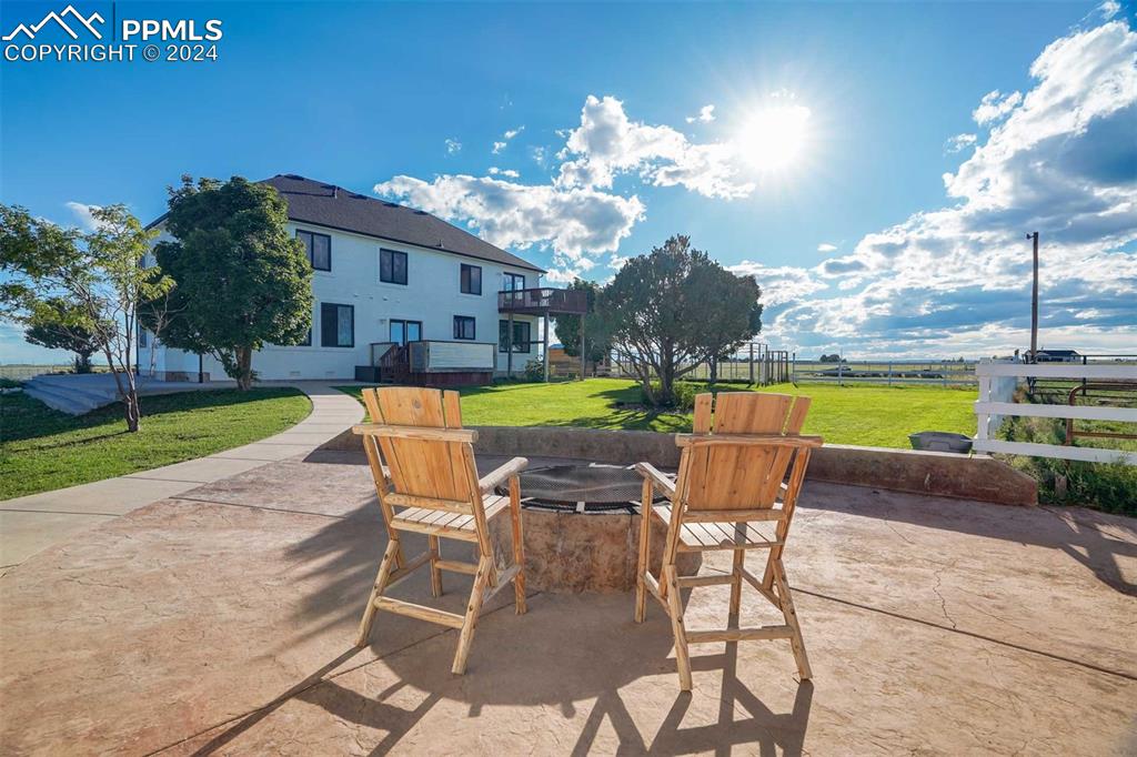 20880 Scott Road Calhan, CO 80808 - Photo 33 of 50 a view of a patio with a table and chairs