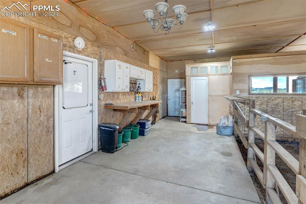 20880 Scott Road Calhan, CO 80808 - Photo 39 of 50 a large room with chandelier fan and windows