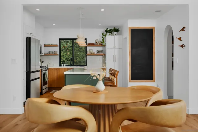 a view of a dining room with furniture and wooden floor