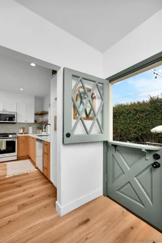 a view of a kitchen with microwave and cabinets
