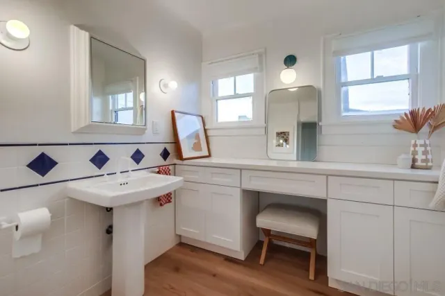 a bathroom with a sink and a mirror
