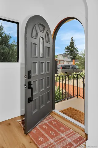 a view of a bedroom with a balcony