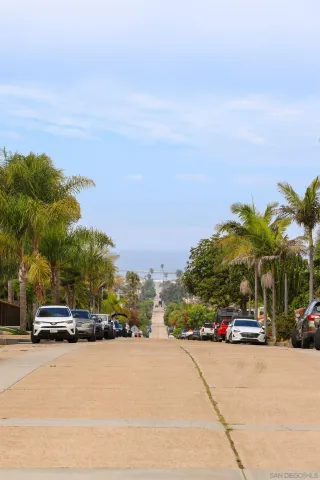 a view of a street with cars
