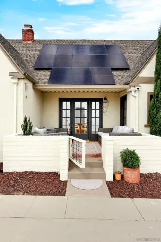 a view of a white building with many windows