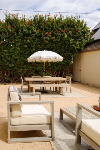 a view of a patio with chairs and tables