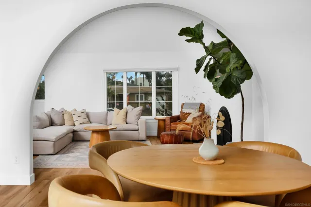 a living room with furniture and a potted plant