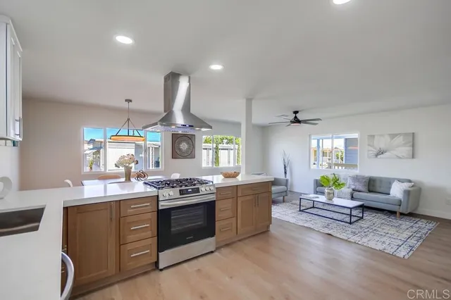 a kitchen with a stove a sink and a refrigerator