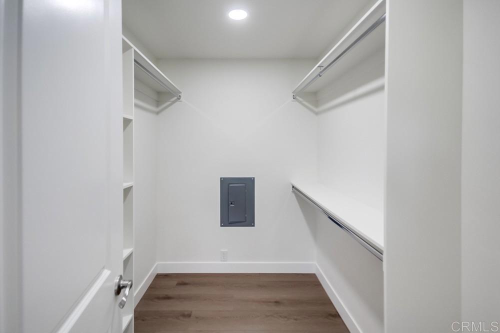 8301 Mission Gorge Road, Unit 208 Santee, CA 92071 - Photo 14 of 22 a view of hallway with stairs and wooden floor