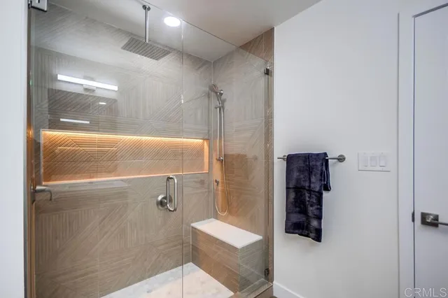 a bathroom with a shower and a sink