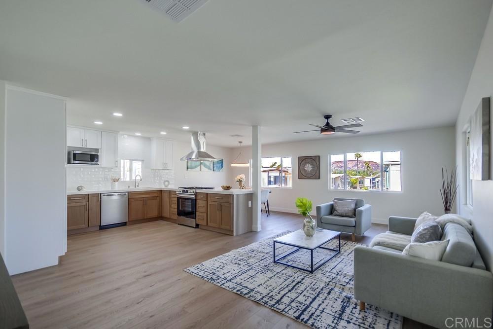 8301 Mission Gorge Road, Unit 208 Santee, CA 92071 - Photo 4 of 22 a living room with furniture kitchen view and a table