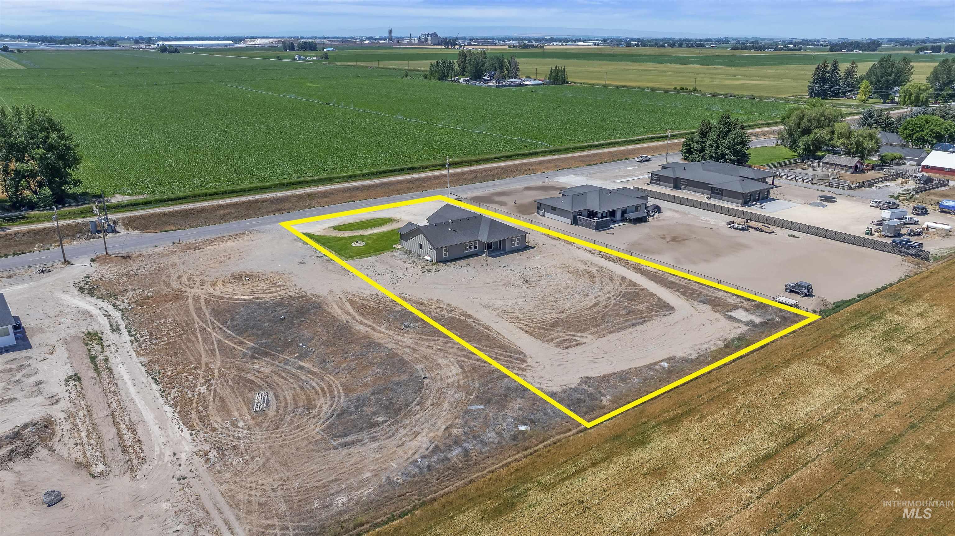 378 West 100 South Rupert, ID 83350 - Photo 50 of 50 Aerial perspective showcasing a single-story residence with a dark roof and light-toned siding