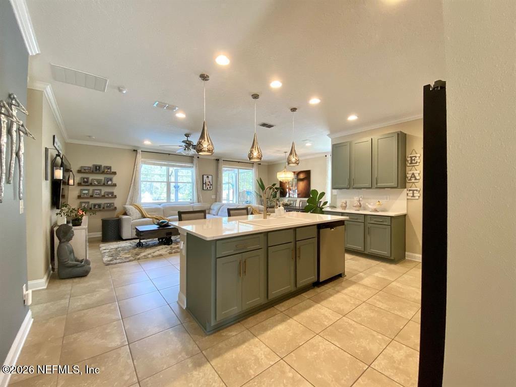 115 Sierras Loop St. Augustine, FL 32086 - Photo 17 of 65 a kitchen with a sink and counter top space
