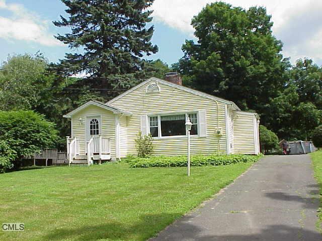 26 Plumtrees Road Bethel, CT 06801 - Photo 1 of 1 a front view of house with yard and green space