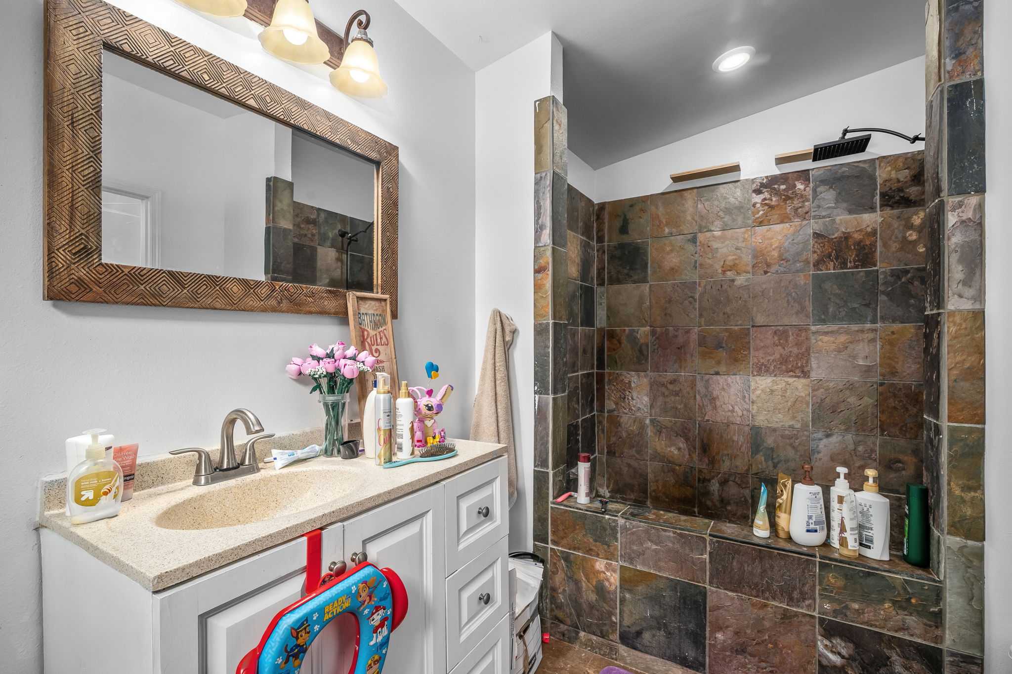 7060 Kahuna Road Kapaa, HI 96746 - Photo 11 of 25 a bathroom with a sink and a mirror