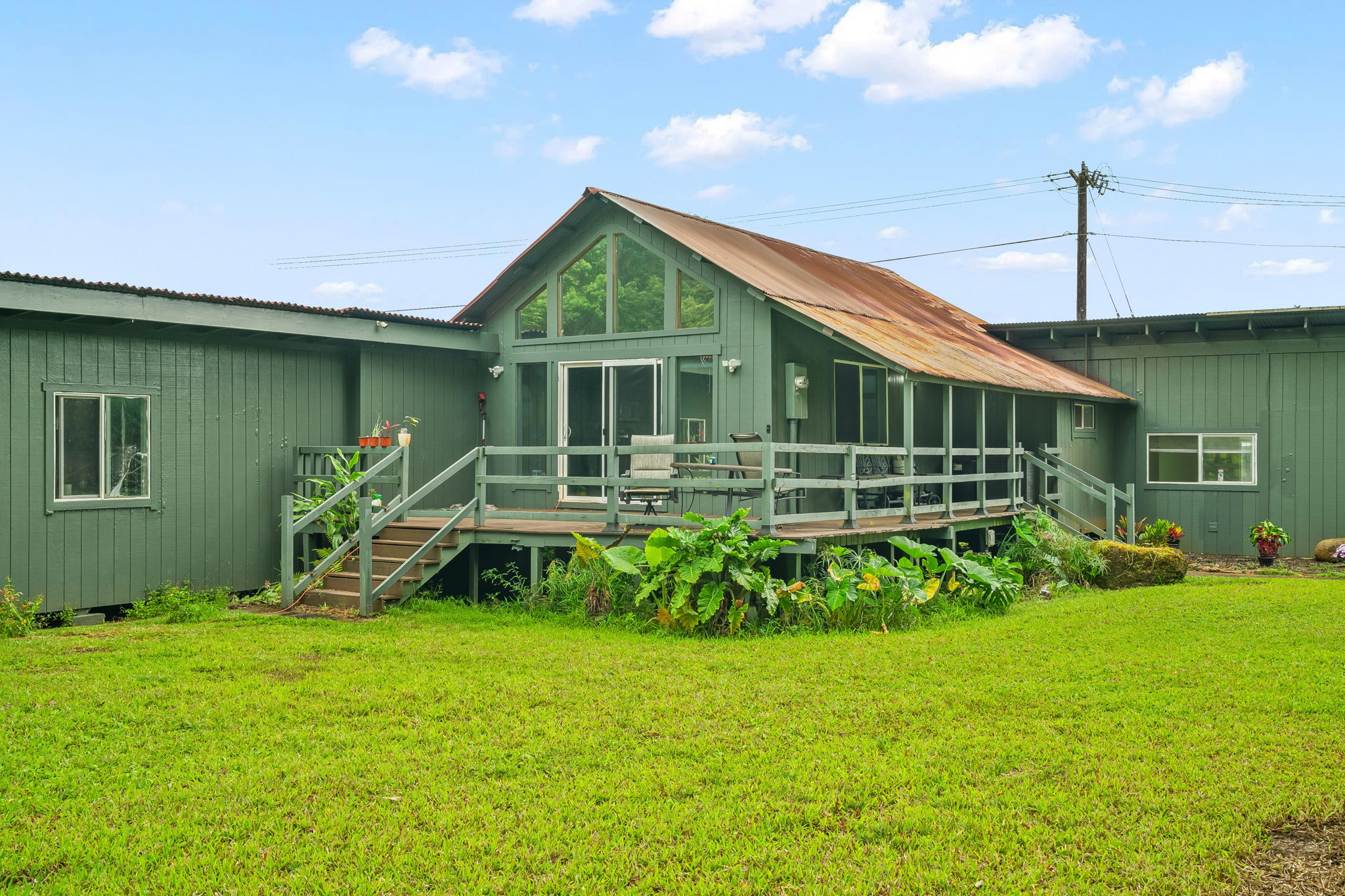 7060 Kahuna Road Kapaa, HI 96746 - Photo 20 of 25 a front view of a house with garden