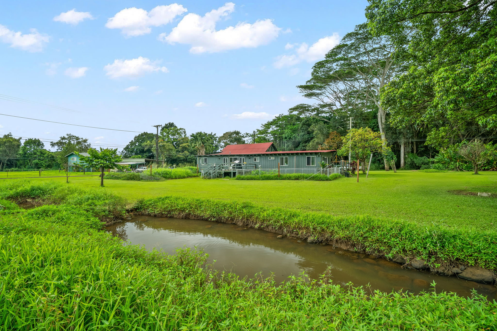 7060 Kahuna Road Kapaa, HI 96746 - Photo 22 of 25 a view of a golf course with a lake