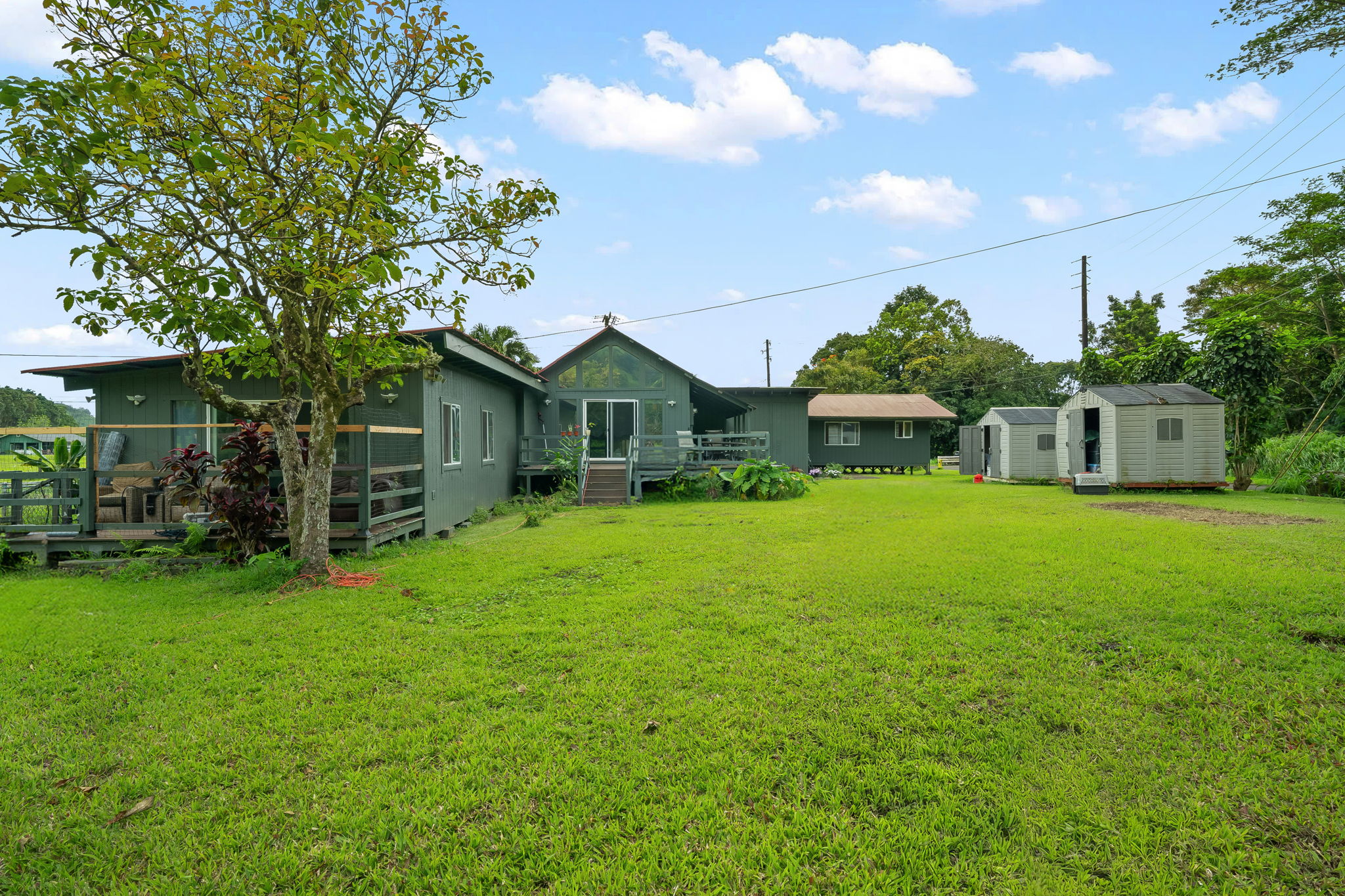 7060 Kahuna Road Kapaa, HI 96746 - Photo 24 of 25 a front view of a house with garden