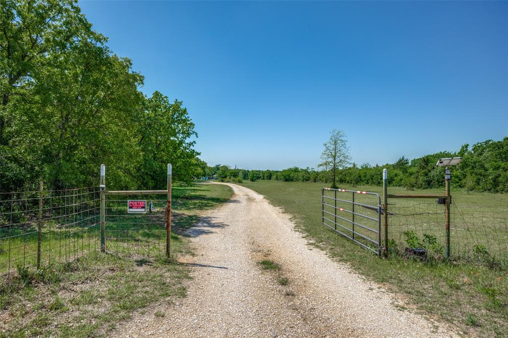 119 Private Road 1186 Decatur, TX 76234 - Photo 2 of 12 a view of a lake with a bridge