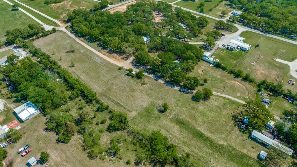 119 Private Road 1186 Decatur, TX 76234 - Photo 10 of 12 a view of a yard with a plants and large trees