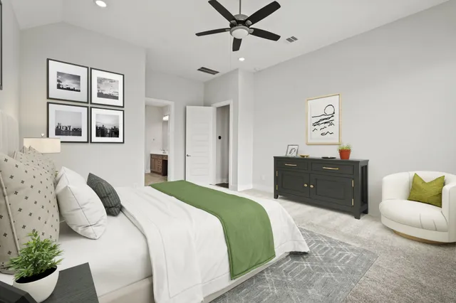 a bedroom with a bed and ceiling fan