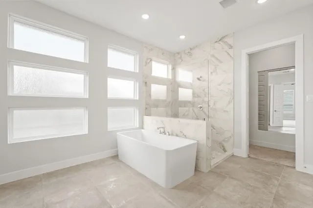 a bathroom with a bathtub and a sink