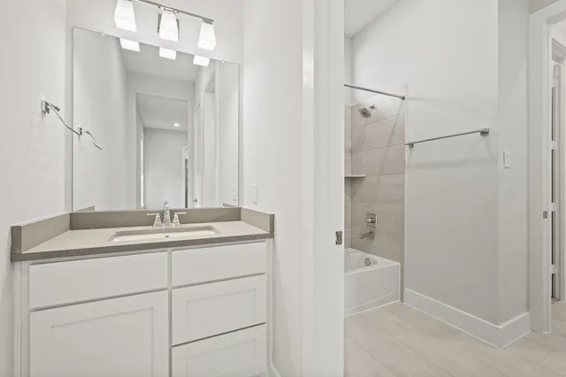 a bed room with a bed and a dresser