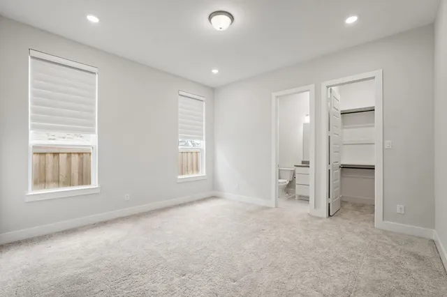 a bathroom with a toilet a sink and shower