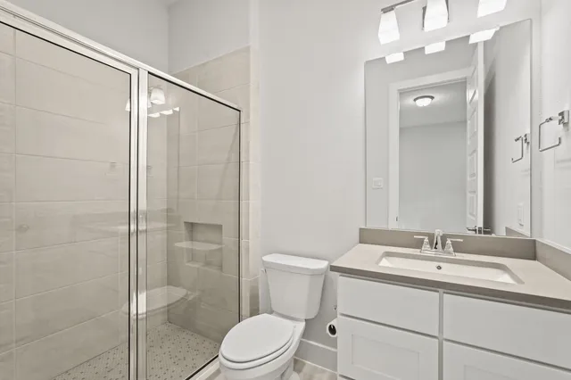 a living room with furniture and floor to ceiling window