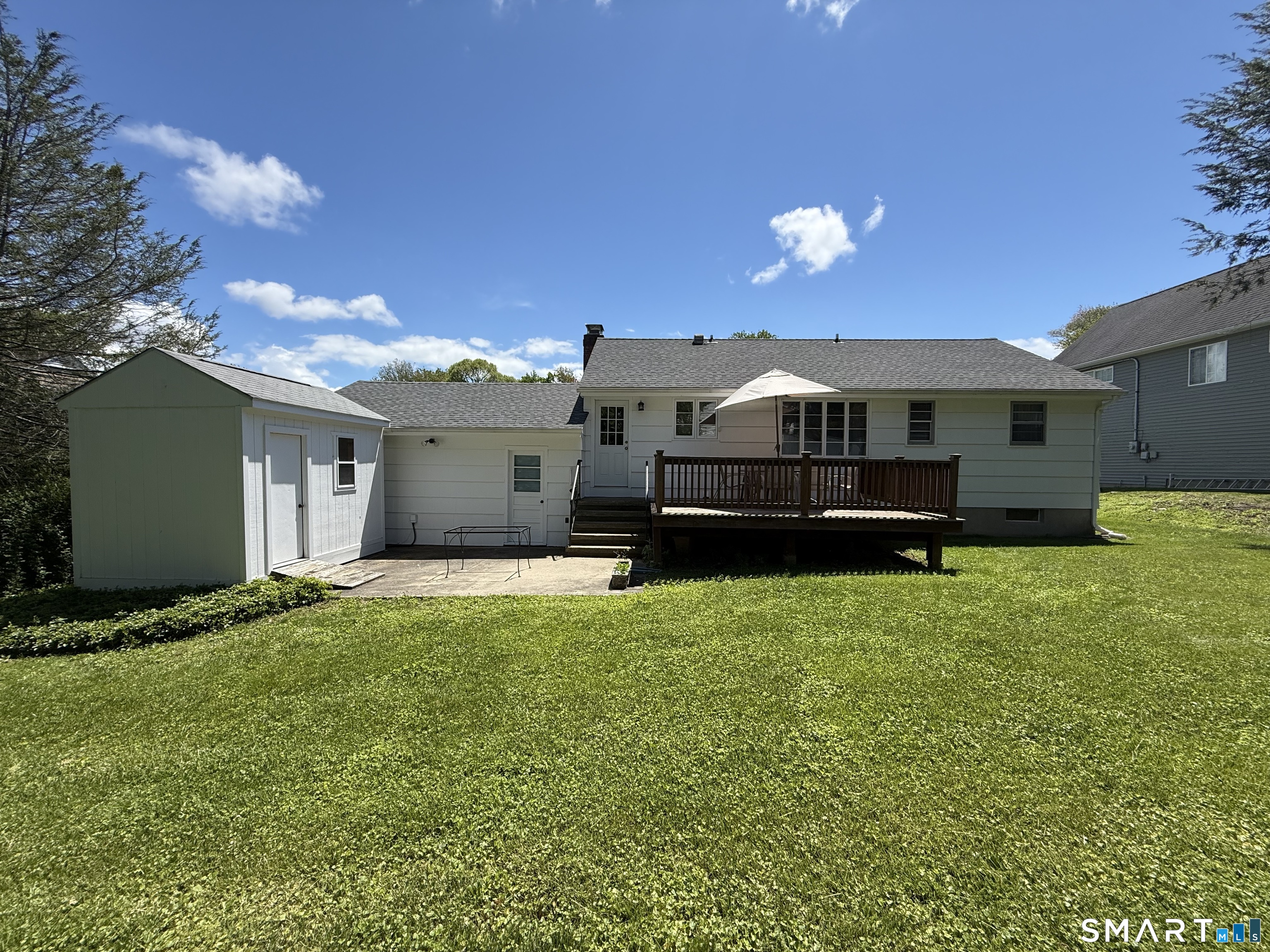 26 Maple Street Trumbull, CT 06611 - Photo 3 of 37 a view of a house with a back yard