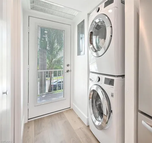a view of a bedroom with washer and dryer