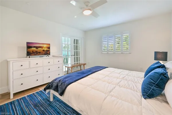 a bedroom with a bed and a dresser