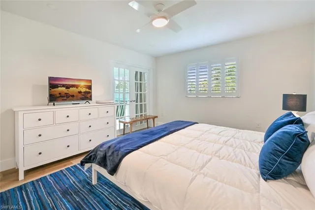 a bedroom with a bed and a dresser