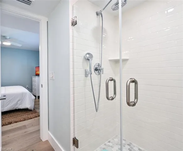 a bathroom with a sink and shower