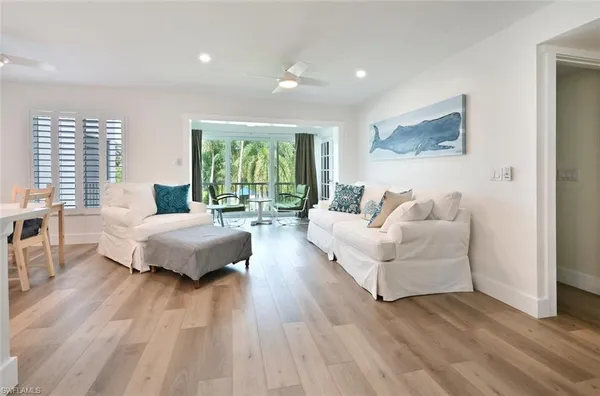 a spacious bedroom with a bed and a large window