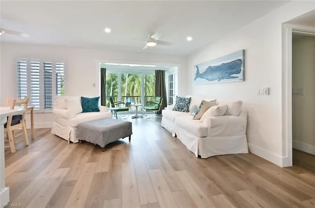 a spacious bedroom with a bed and a large window