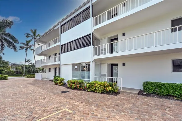 a view of a chair and table in the garden