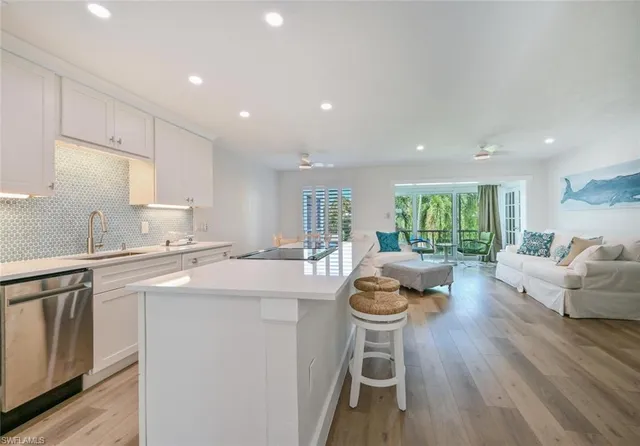 a kitchen with a table chairs stove and cabinets