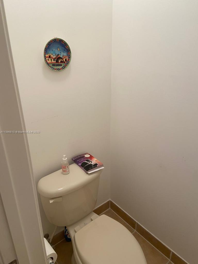 7765 Paddock Place, Unit 7765 Davie, FL 33328 - Photo 12 of 40 a bathroom with a toilet and a sink