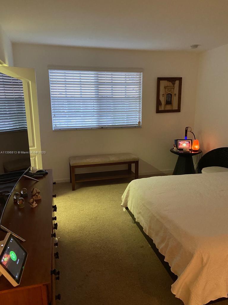 7765 Paddock Place, Unit 7765 Davie, FL 33328 - Photo 14 of 40 a bedroom with a bed and two windows